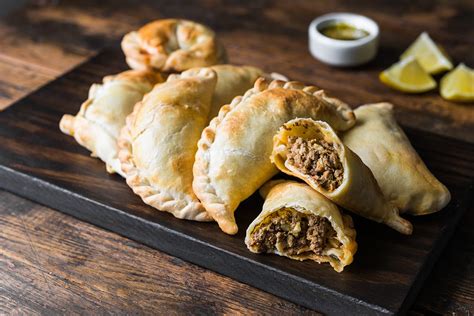 Jan 10, 2024 · Empanada Jujeña: Filled with beef, chicken, goat, and llama meat. Peas, onions, garlic, and chili are also common ingredients. Empanada Cordobesa: A sweeter type of empanada made with white sugar and filled with beef, raisins, potatoes, and olives. Empanada Entrerriana: Empanada filled with milk-soaked rice. 